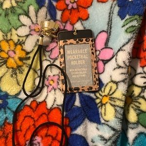 Bath & Body ID holder with a sanitizer holder.